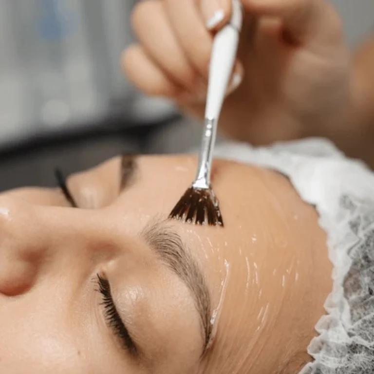 dermatologist-applying-chemical-peel-brush-600nw-2515554255