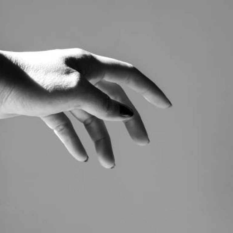 A hand with a gray background